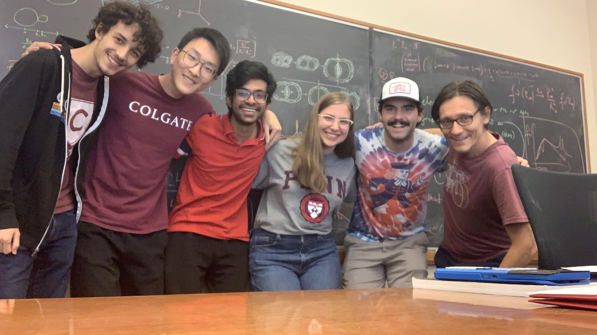 Cosmin Ilie with his research group at the blackboard